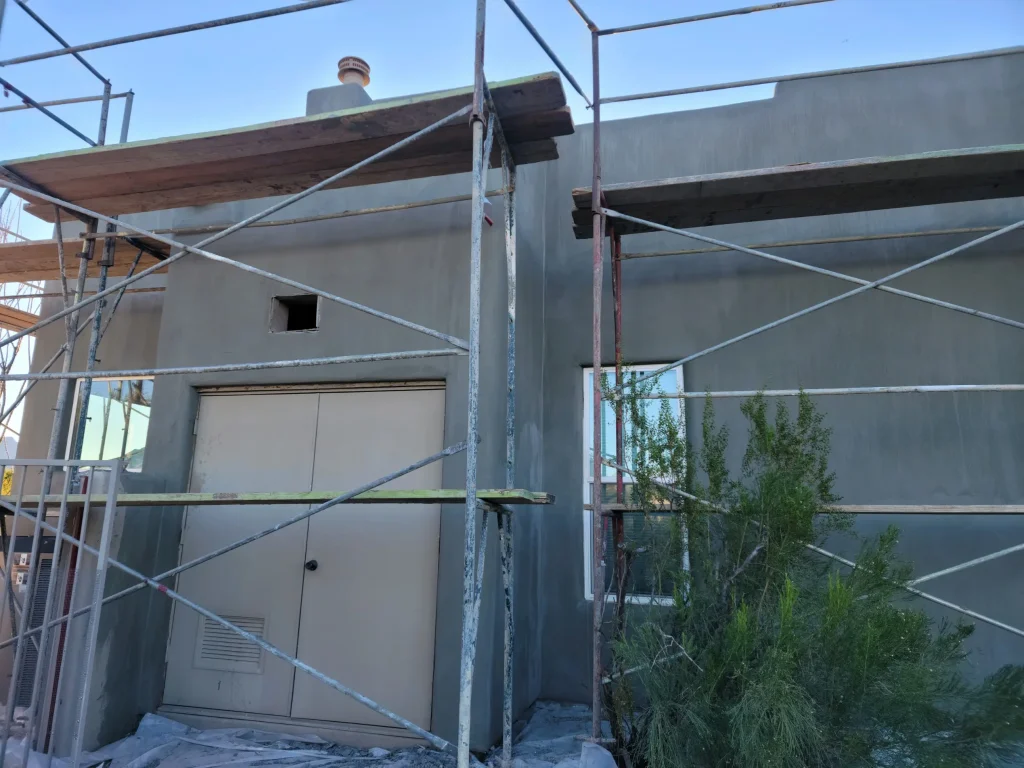 Corner wall with broken stucco before fix, Stucco Renovations AZ